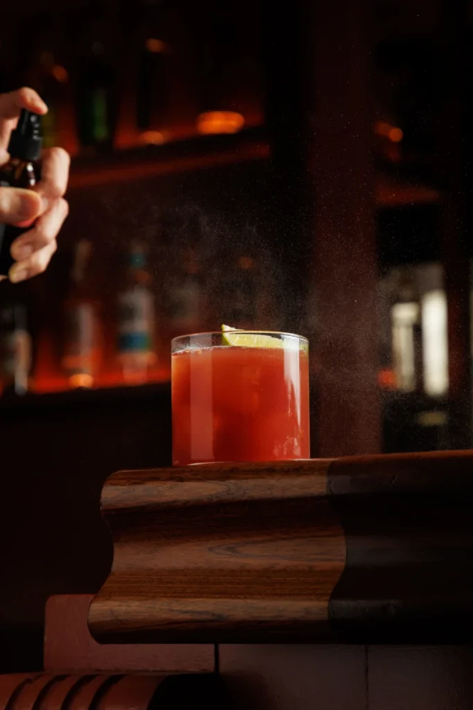 Khubani White Negroni served at Tanvi, an Indian restaurant and cocktail lounge in St George’s Bay Malta, featuring mezcal, sake and spiced apricot