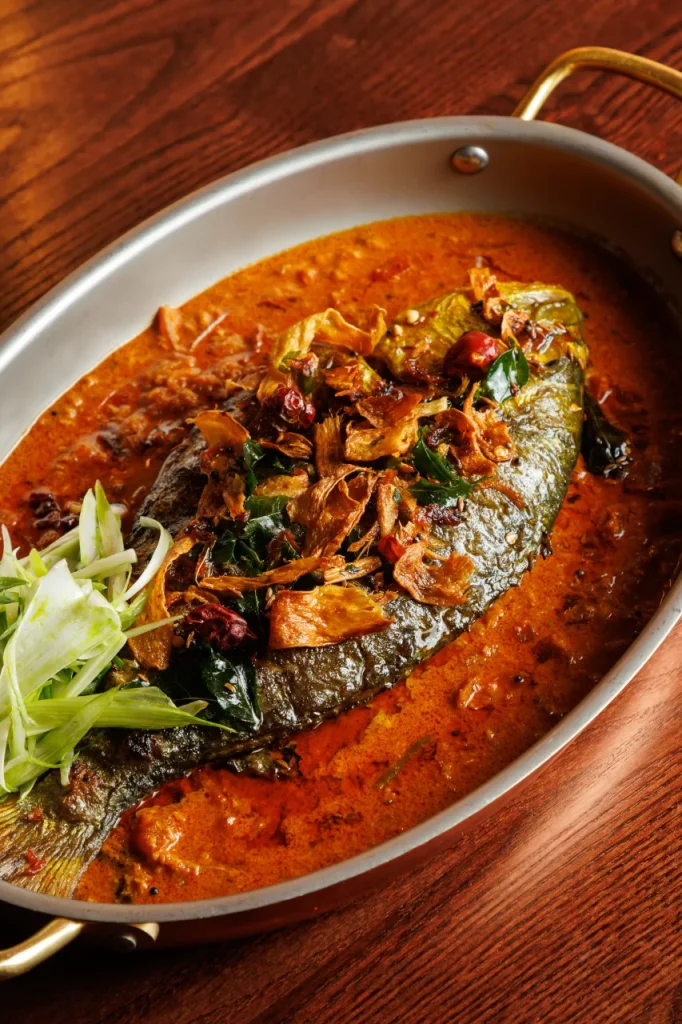 Malabar whole sea bream served at Tanvi, an Indian restaurant in St George’s Bay Malta, with curry leaves and fried shallots.